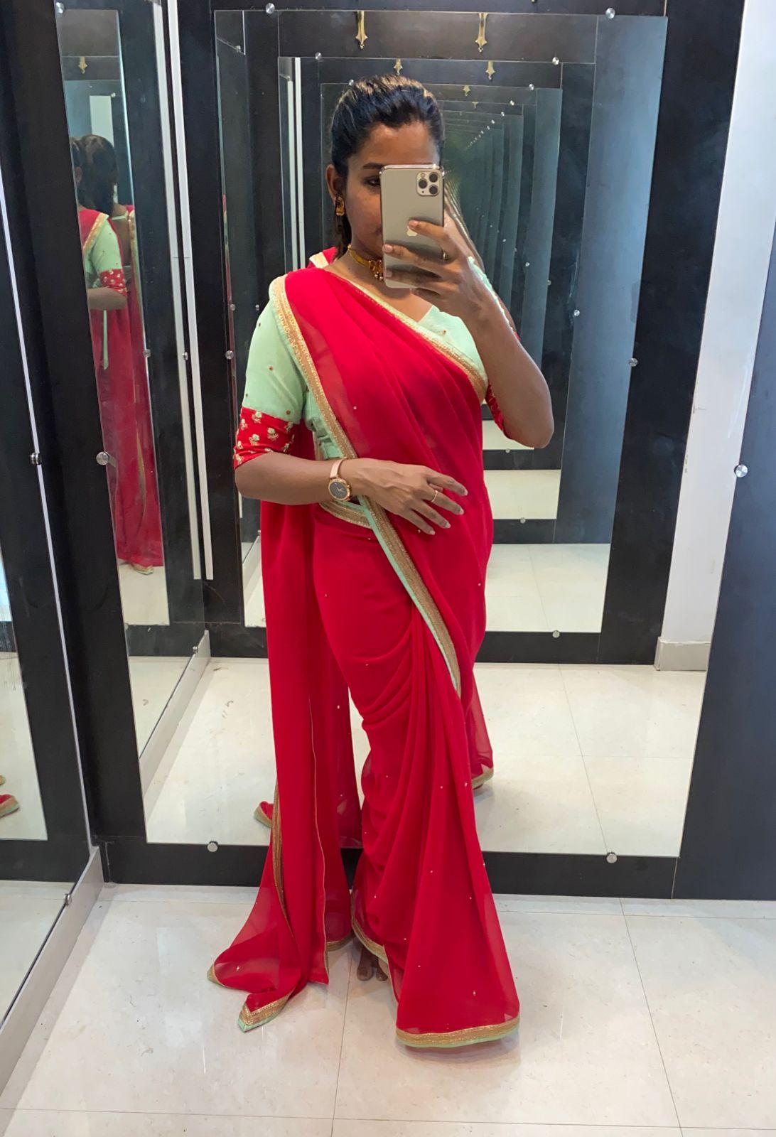Red Georgette saree with sea green designer blouse - Threads