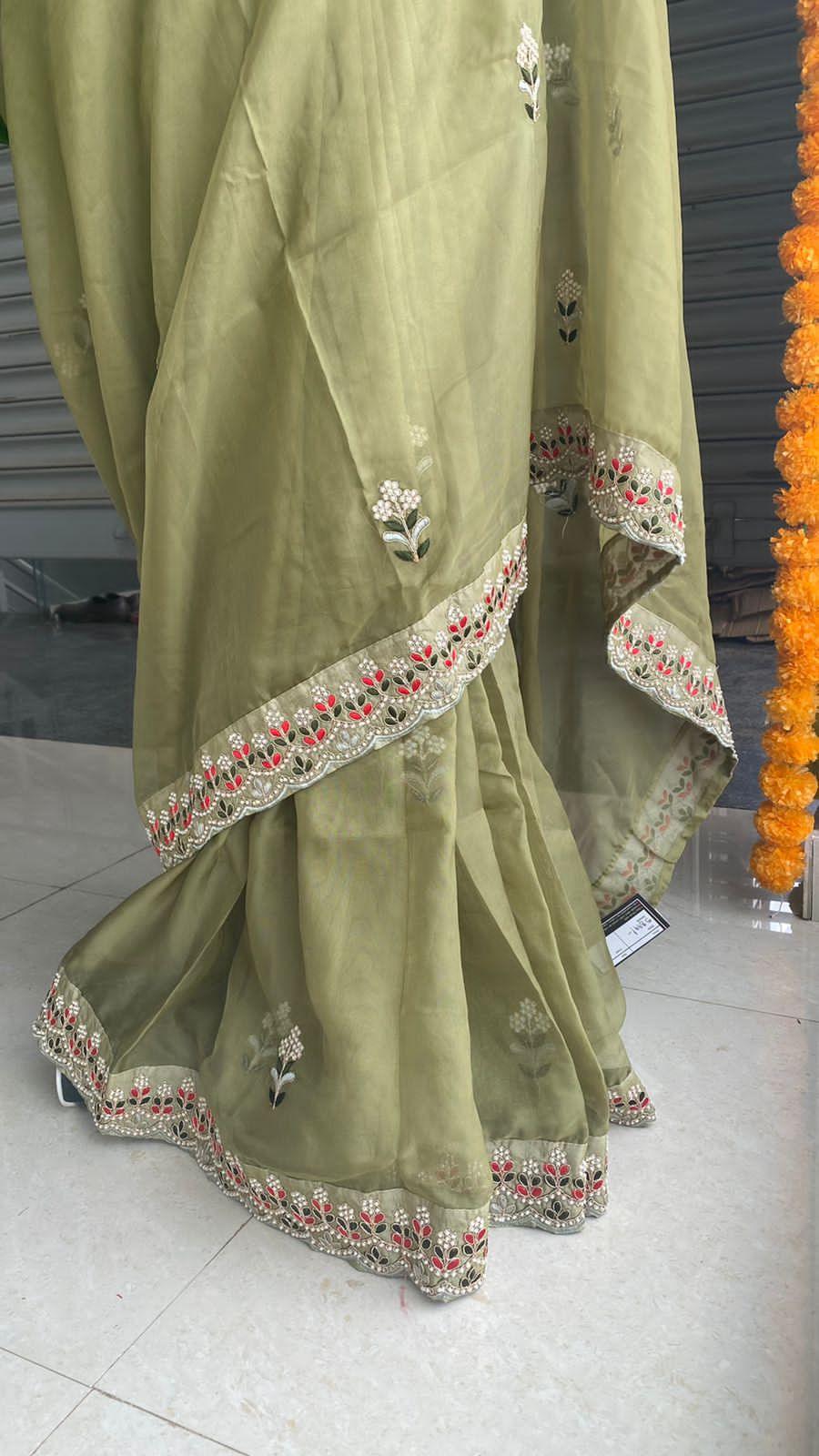 Mehandi green organza saree with silk embroidery blouse - Threads