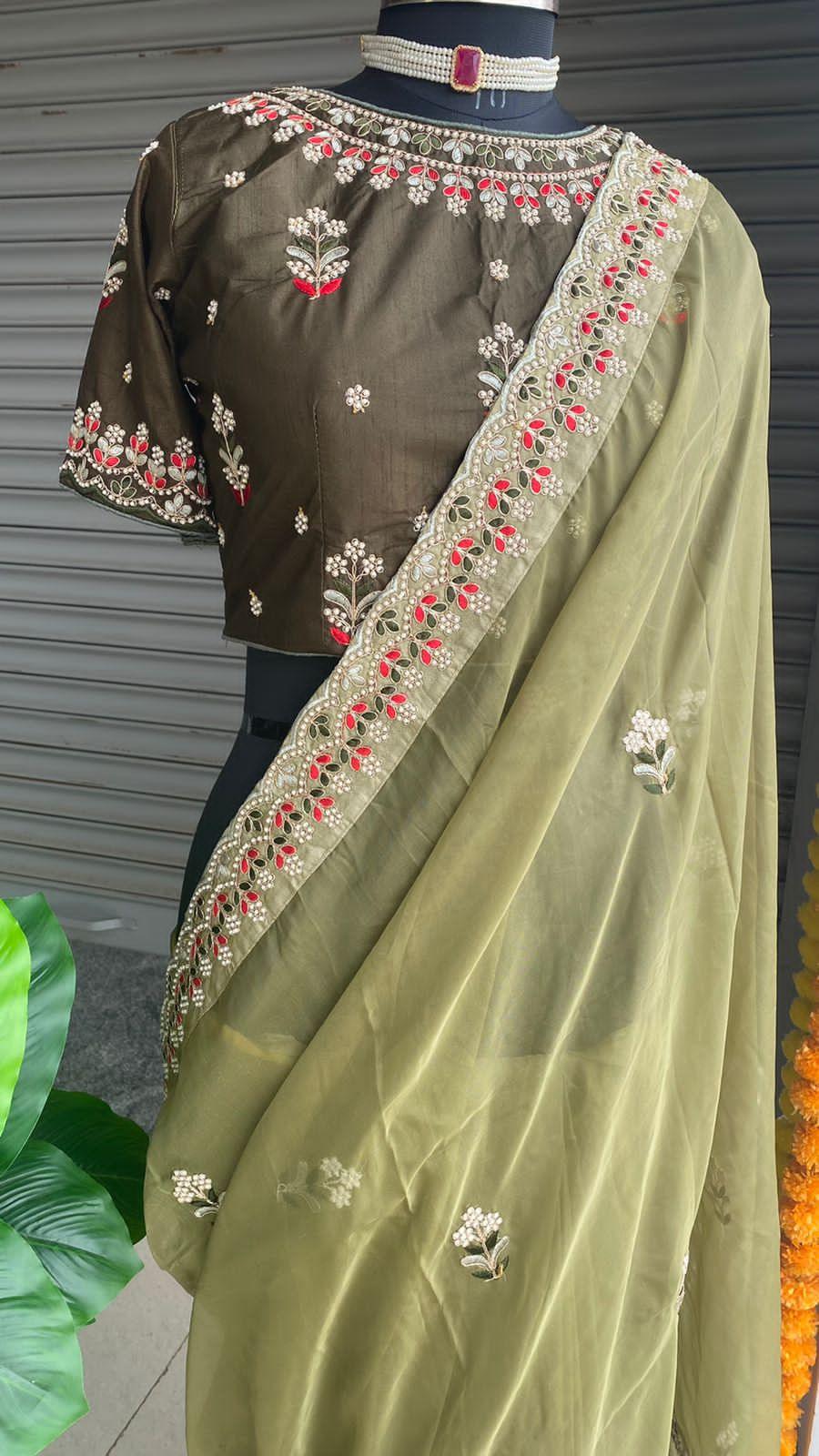 Mehandi green organza saree with silk embroidery blouse - Threads