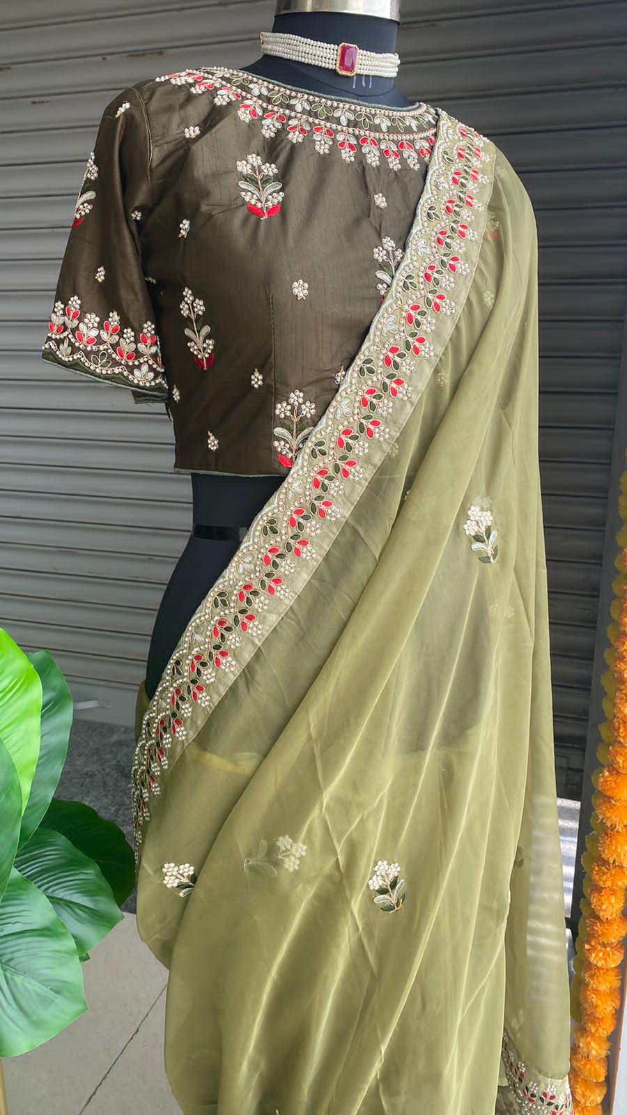Mehandi green organza saree with silk embroidery blouse - Threads