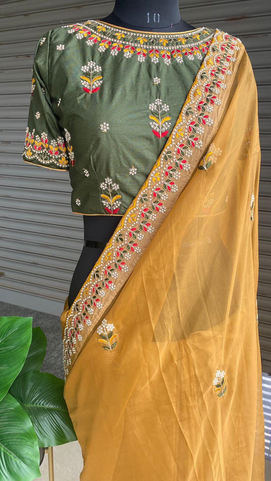 Light orange organza saree with silk embroidery blouse - Threads