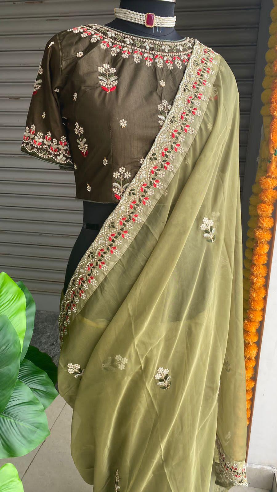 Mehandi green organza saree with silk embroidery blouse - Threads