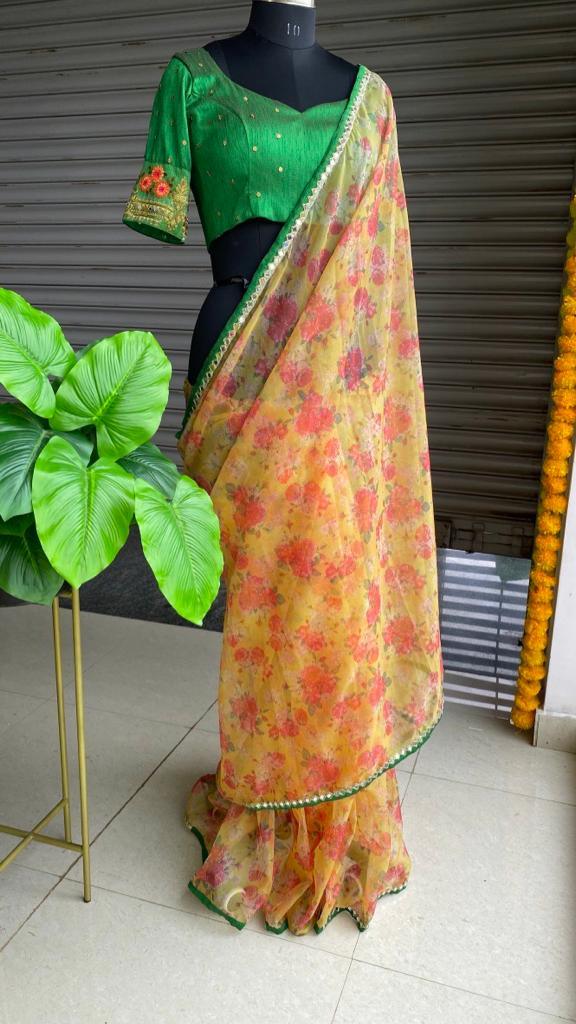 Yellow organza saree with red hand worked Blouse - Threads