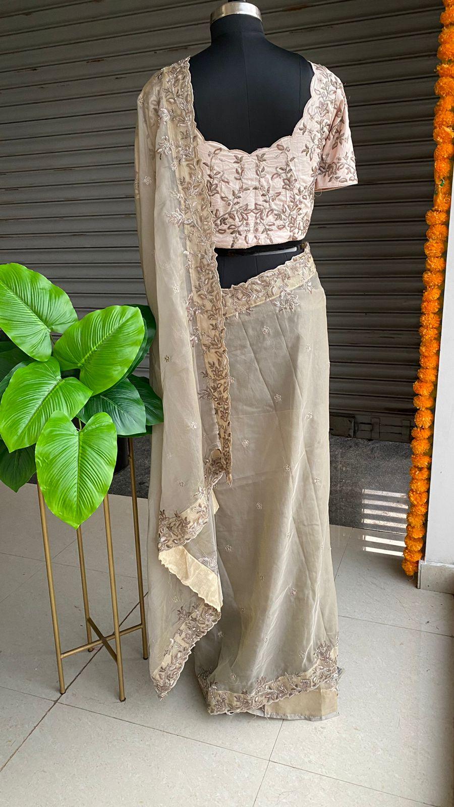 Grey organza saree with hand worked embroidery peach blouse - Threads