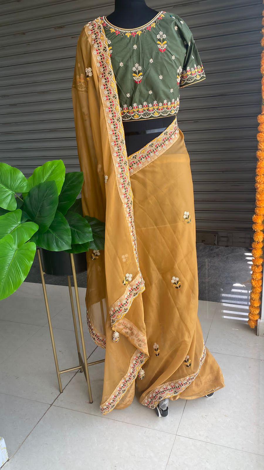 Light orange organza saree with silk embroidery blouse - Threads