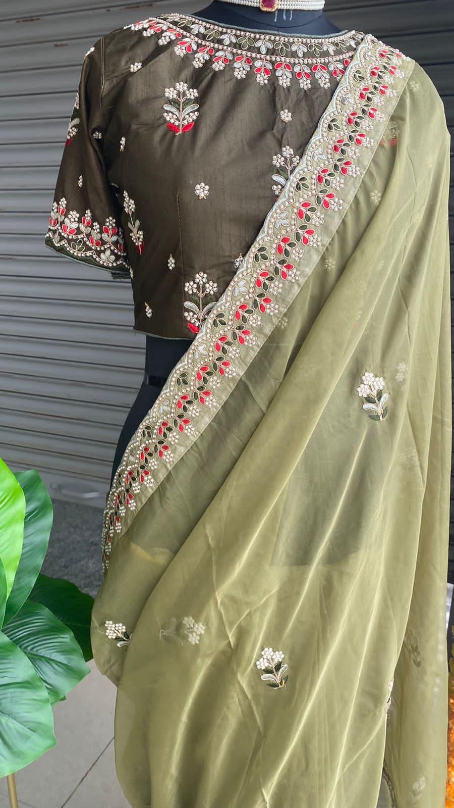 Mehandi green organza saree with silk embroidery blouse - Threads