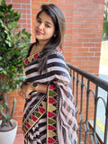 Black and white organza saree with embroidered blouse