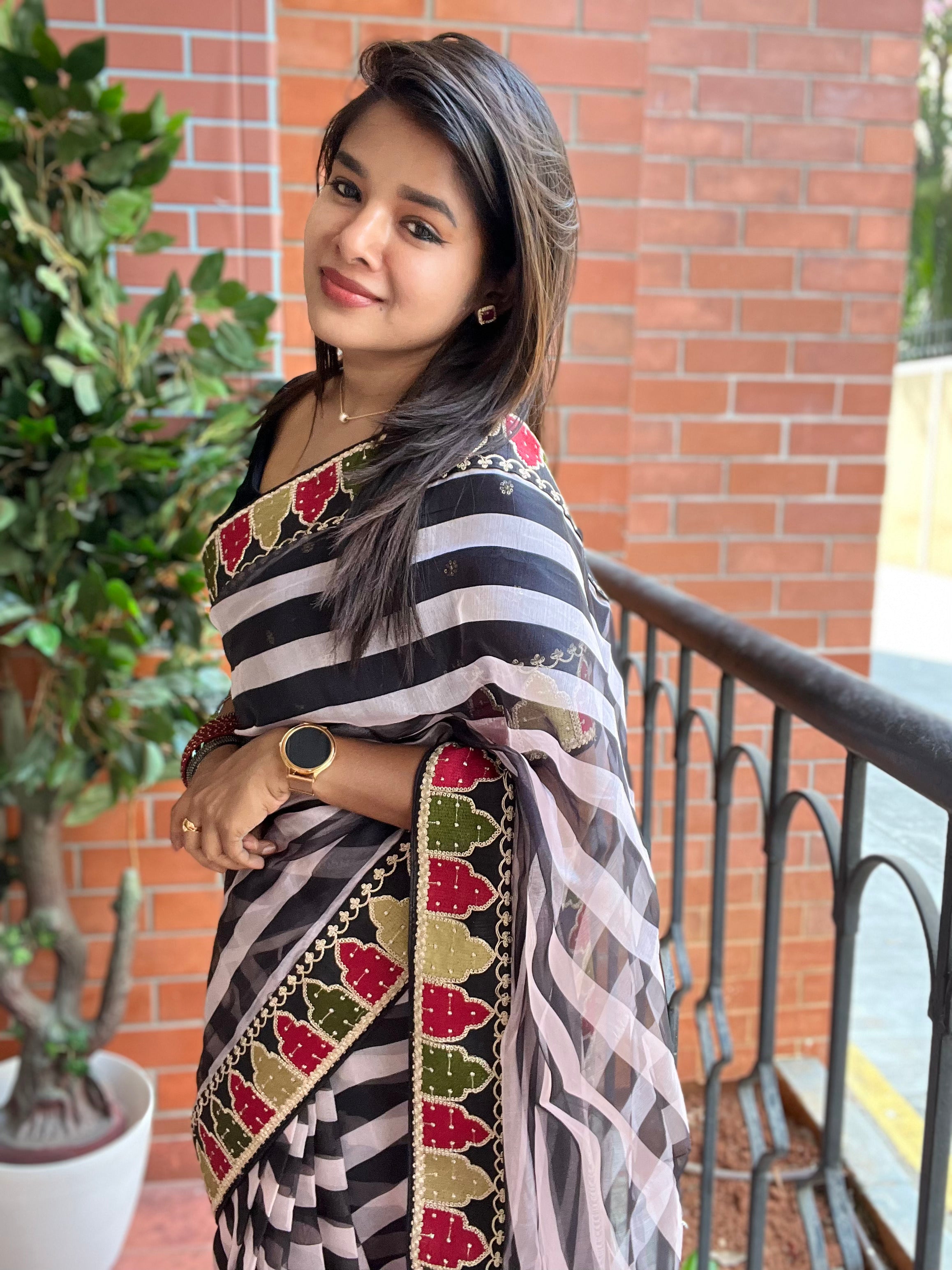 Black and white organza saree with embroidered blouse