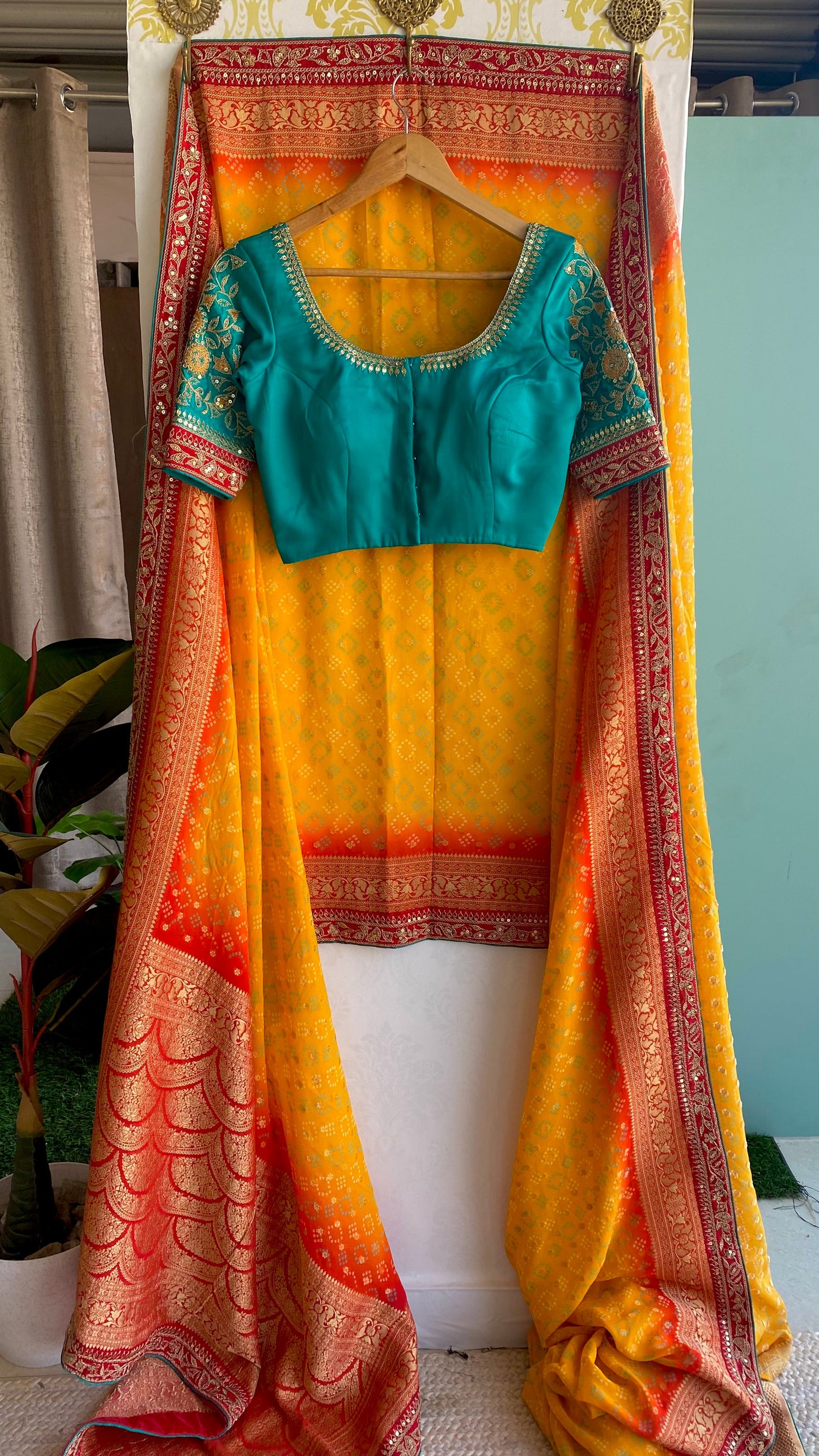 Orange banarasi saree with sea green blouse