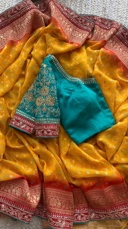 Orange banarasi saree with sea green blouse