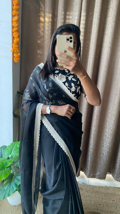 Black soft organza saree with netted embroidery blouse