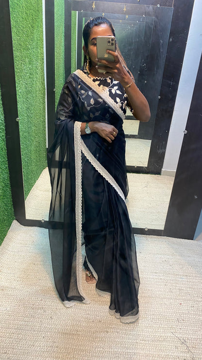 Black soft organza saree with netted embroidery blouse