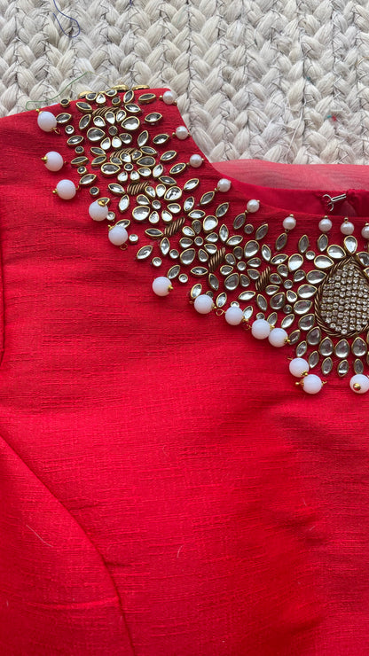 Red organza saree with jewel neck red blouse