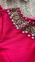 Pink organza saree with jewel neck pink blouse
