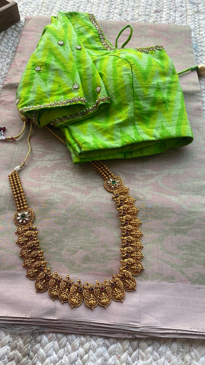 Cream white kanchipuram silk saree with hand worked blouse