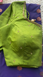 Blue silk saree with green hand worked blouse