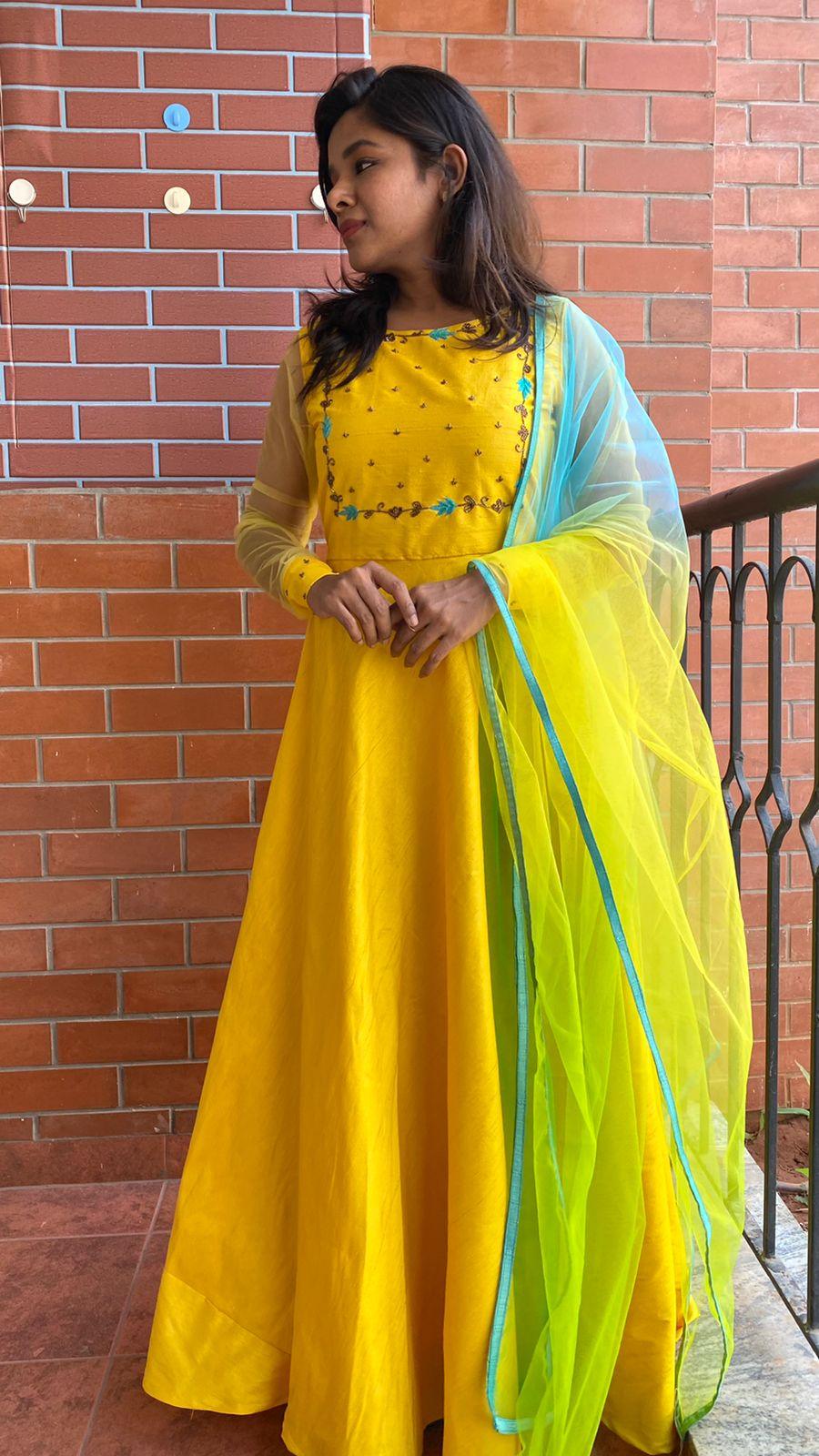 Yellow Bloom handworked top and a yellow Duppata salwar suit - Threads