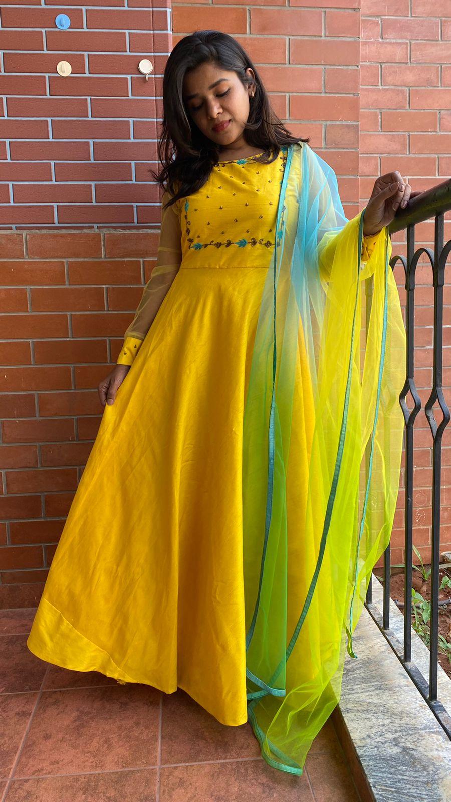 Yellow Bloom handworked top and a yellow Duppata salwar suit - Threads