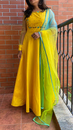 Yellow Bloom handworked top and a yellow Duppata salwar suit - Threads