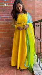 Yellow Bloom handworked top and a yellow Duppata salwar suit - Threads