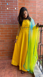 Yellow Bloom handworked top and a yellow Duppata salwar suit - Threads