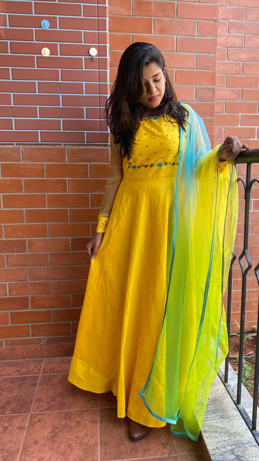 Yellow Bloom handworked top and a yellow Duppata salwar suit - Threads