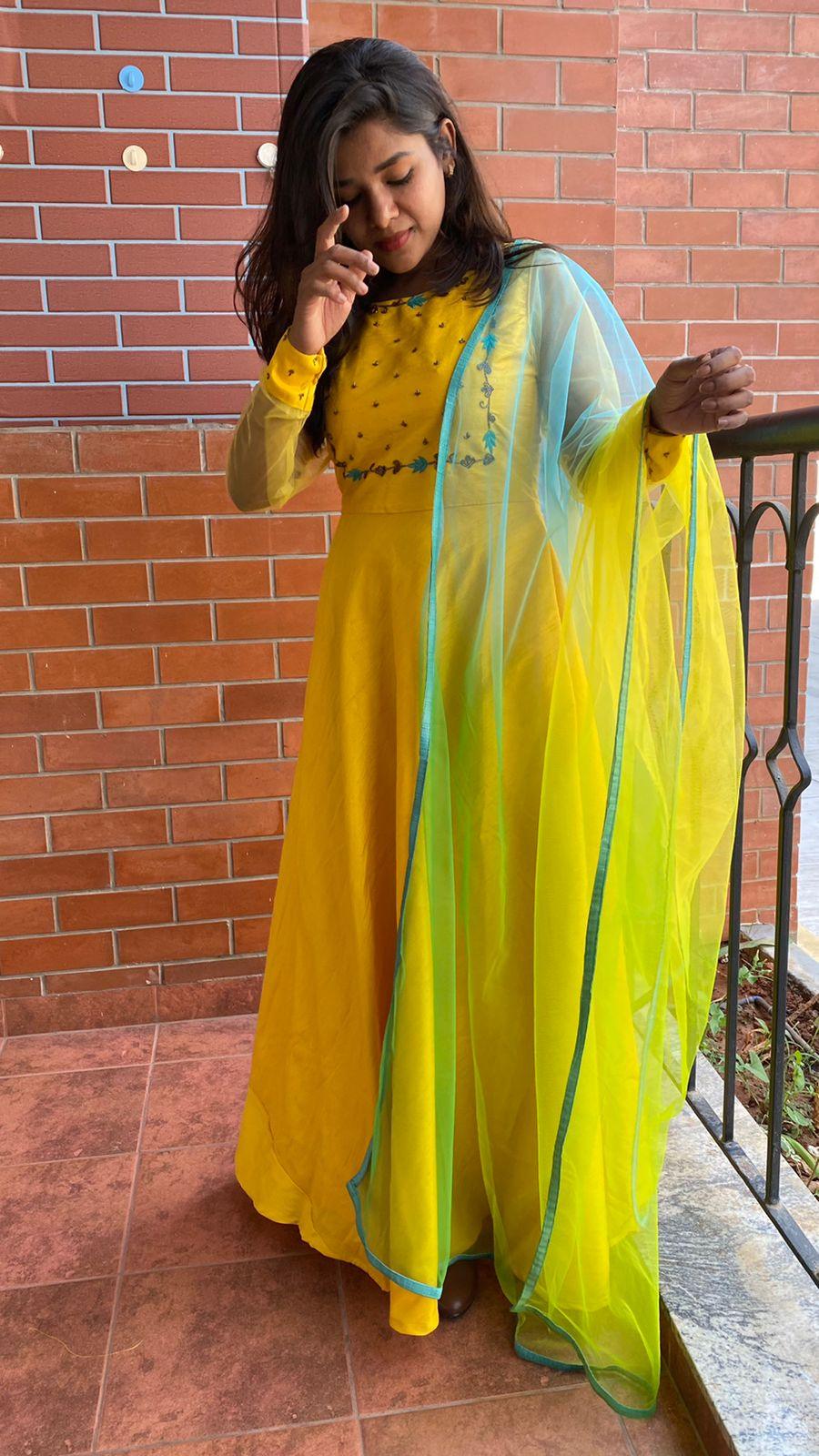 Yellow Bloom handworked top and a yellow Duppata salwar suit - Threads