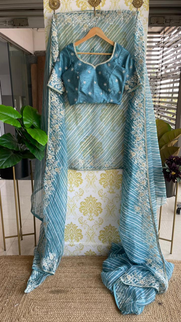 Lehariya Blue organza saree with blue hand worked blouse - Threads
