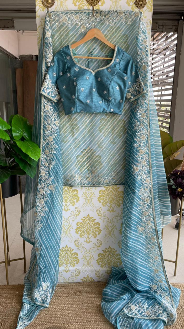 Lehariya Blue organza saree with blue hand worked blouse - Threads