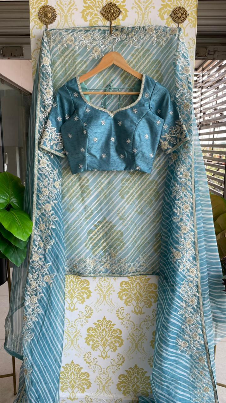 Lehariya Blue organza saree with blue hand worked blouse - Threads