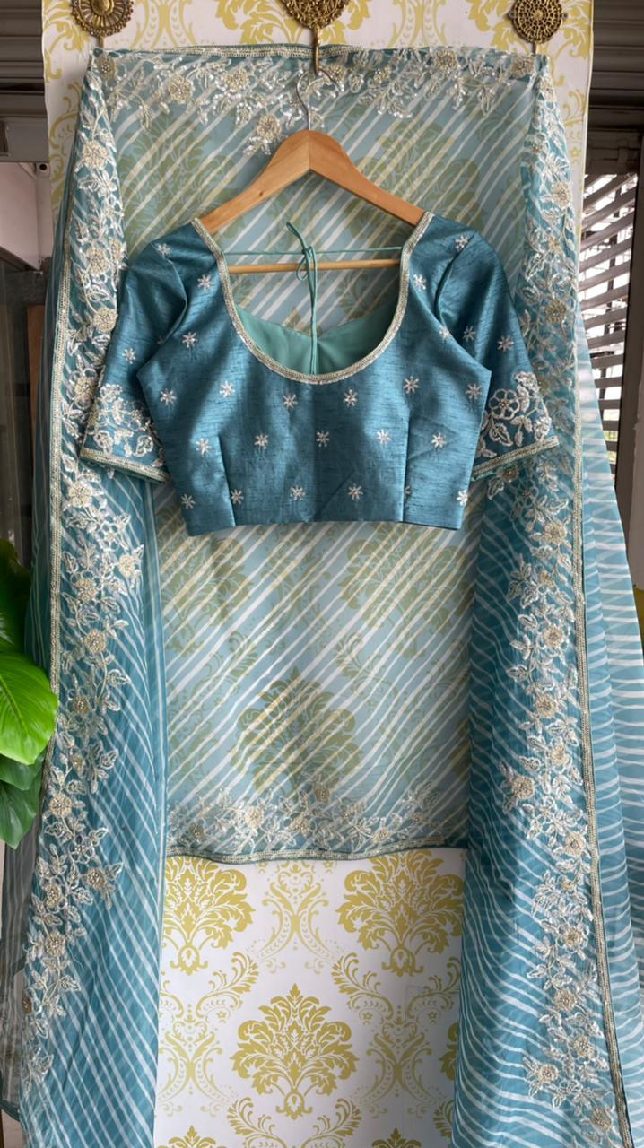 Lehariya Blue organza saree with blue hand worked blouse - Threads