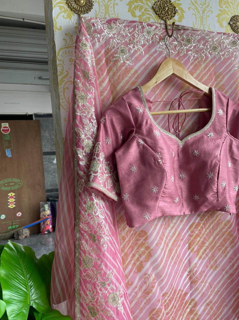 Lehariya pink organza saree with blue hand worked blouse - Threads