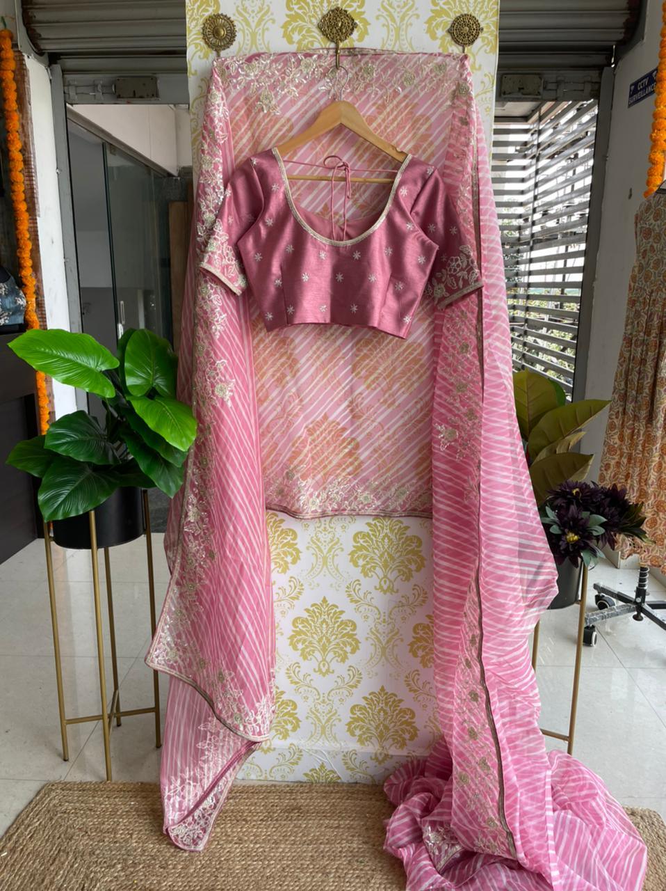 Lehariya pink organza saree with blue hand worked blouse - Threads