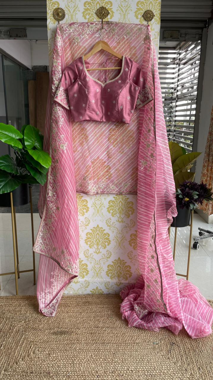 Lehariya pink organza saree with blue hand worked blouse - Threads