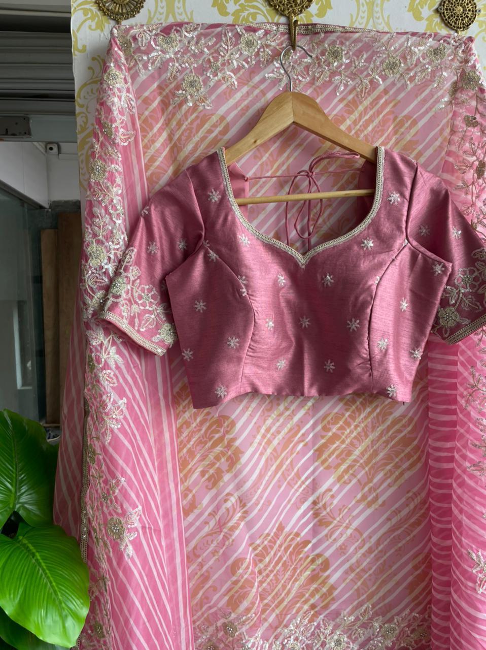 Lehariya pink organza saree with blue hand worked blouse - Threads